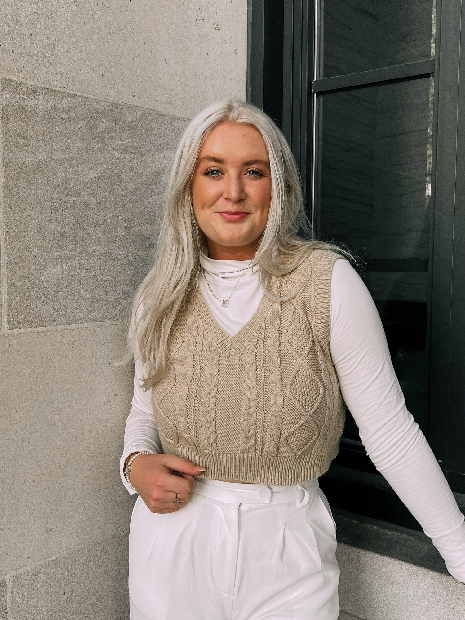 Indie Beauty Branding Co-Founder wearing a neutral outfit with a neutral background