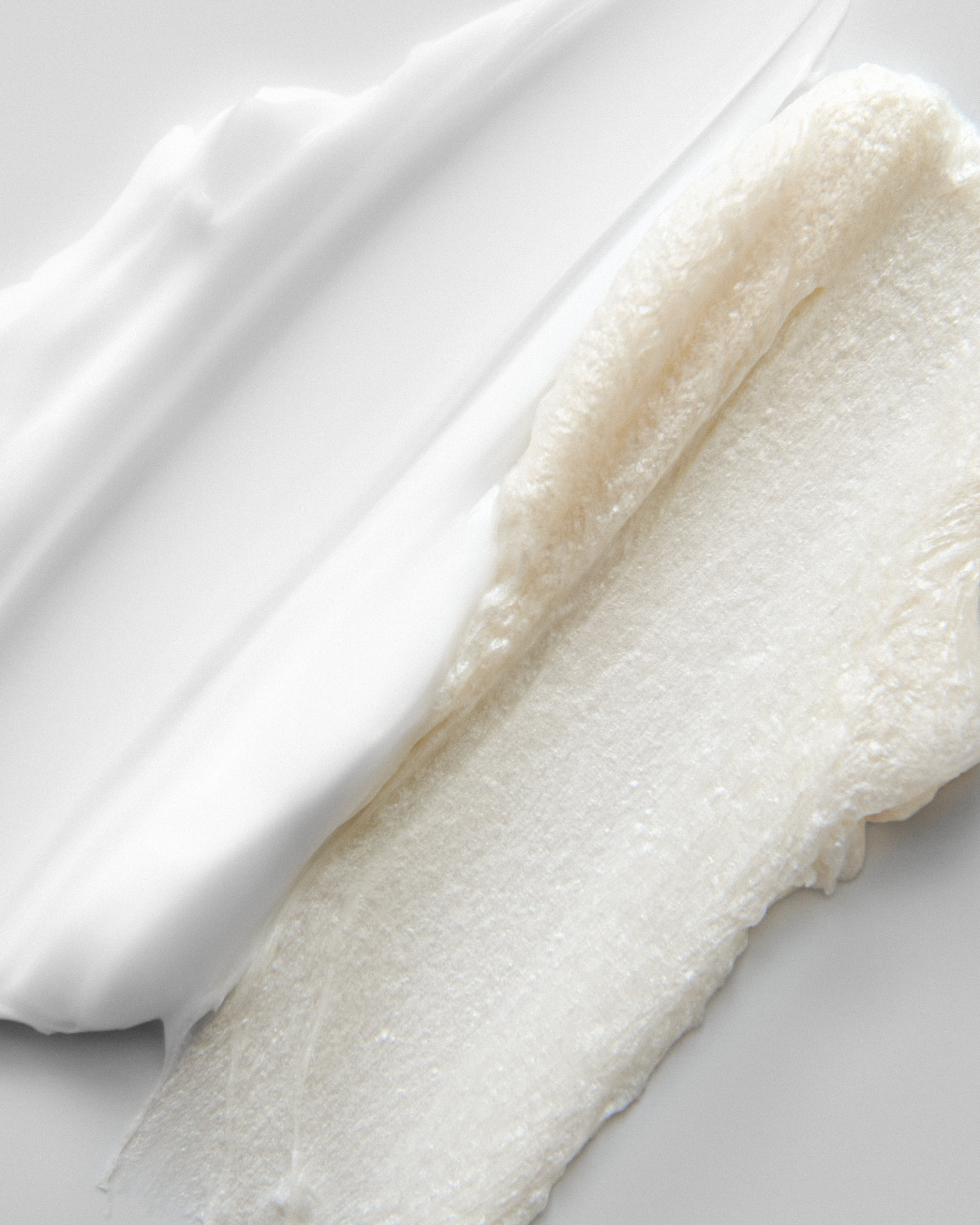 White and cream product texture swipe on neutral background